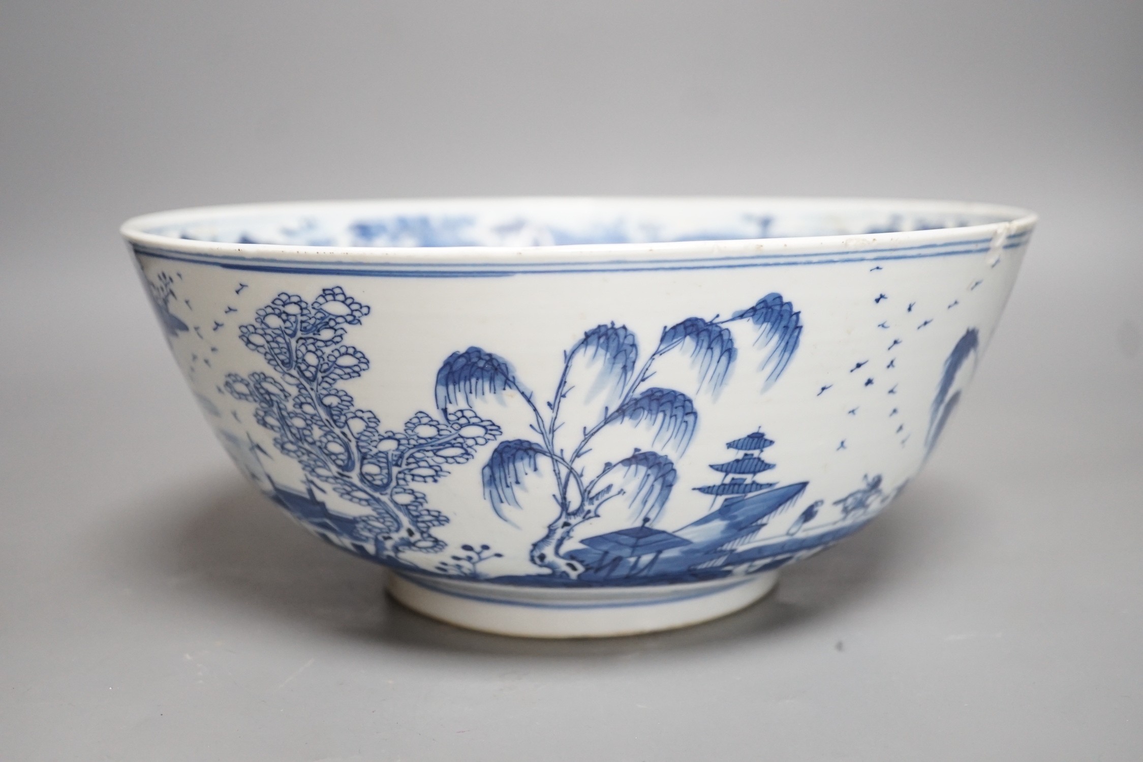 A 19th century Chinese blue and white landscape bowl, 26cm